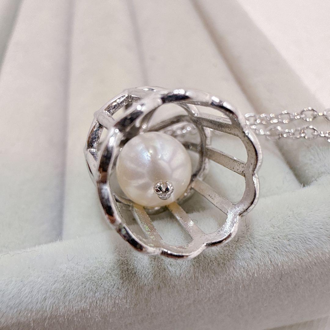 Tasaki Pearl Basket Necklace with bell sound made of 925 silver, shown on white background