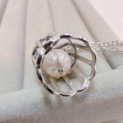 Tasaki Pearl Basket Necklace with bell sound made of 925 silver, shown on white background