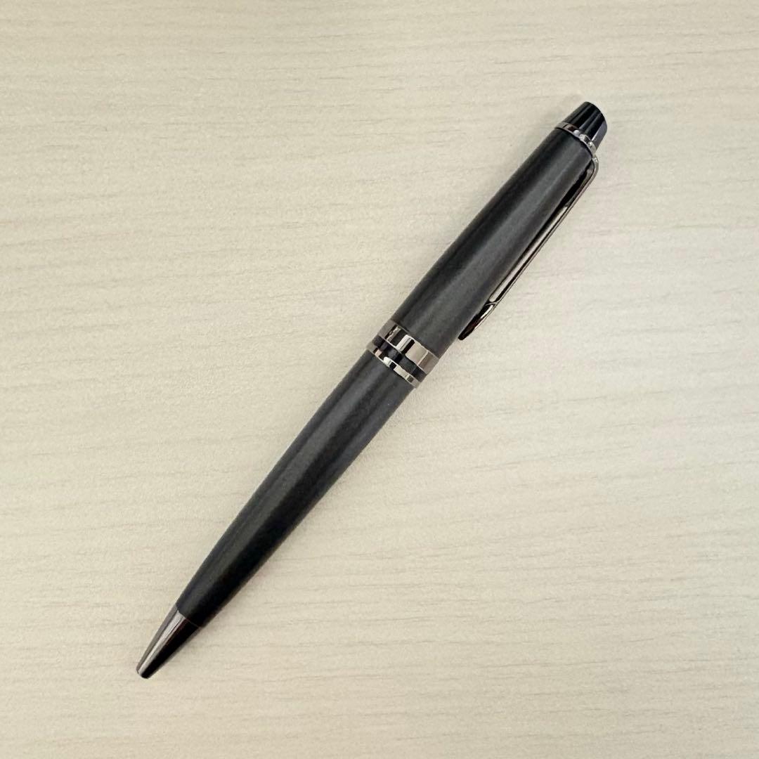 WATERMAN Expert Metallic Black ballpoint pen with included accessories on white background