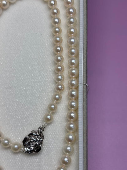 Akoya baby pearl necklace featuring smooth pearls and a silver 925 clasp on a 200mm chain
