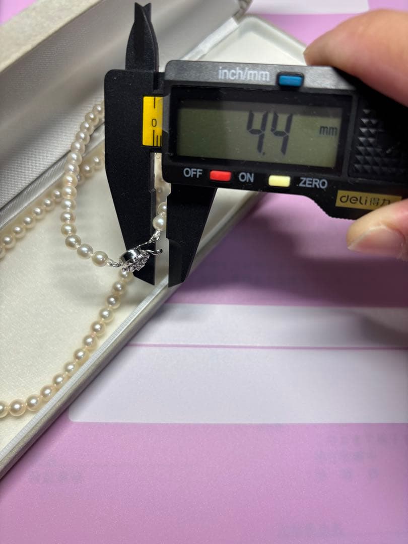 Akoya baby pearl necklace featuring smooth pearls and a silver 925 clasp on a 200mm chain