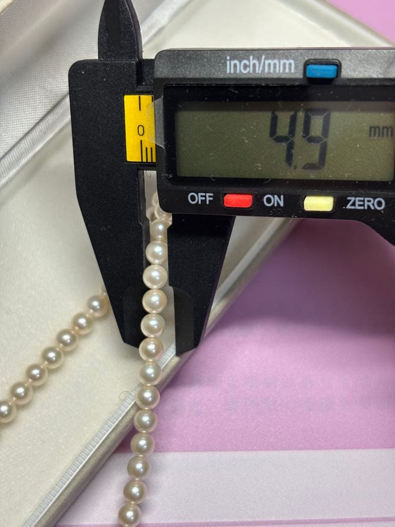 Akoya baby pearl necklace featuring smooth pearls and a silver 925 clasp on a 200mm chain