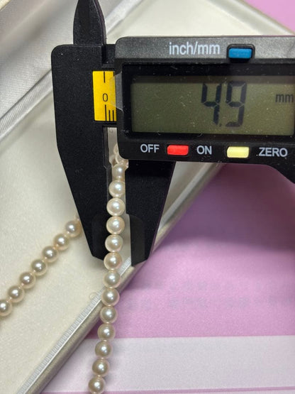 Akoya baby pearl necklace featuring smooth pearls and a silver 925 clasp on a 200mm chain