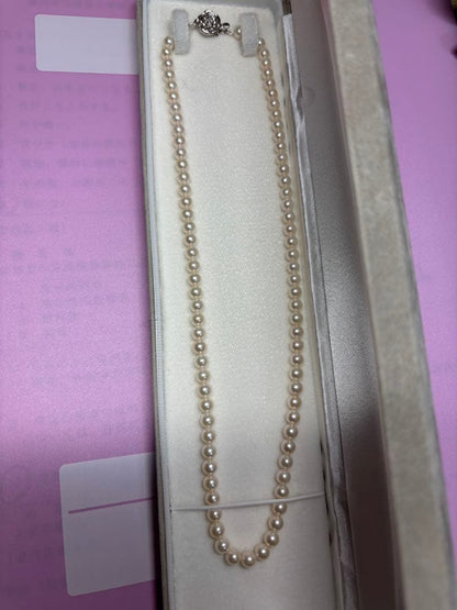 Akoya baby pearl necklace featuring smooth pearls and a silver 925 clasp on a 200mm chain
