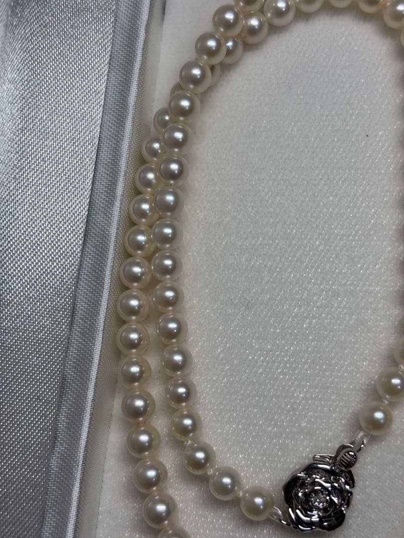 Akoya baby pearl necklace featuring smooth pearls and a silver 925 clasp on a 200mm chain