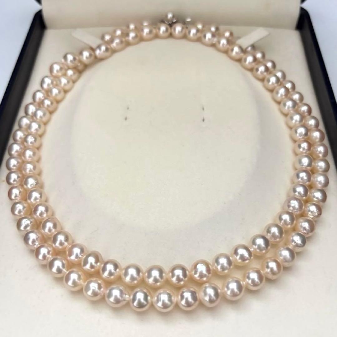 Long double-strand pearl necklace with large Akoya pearls and aurora interference colors in champagne or white gold
