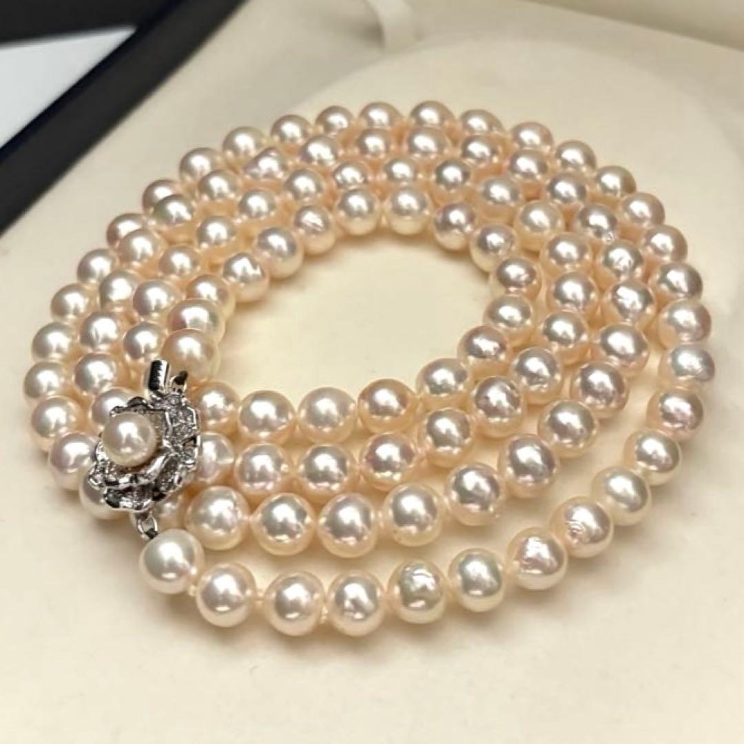 Long double-strand pearl necklace with large Akoya pearls and aurora interference colors in champagne or white gold