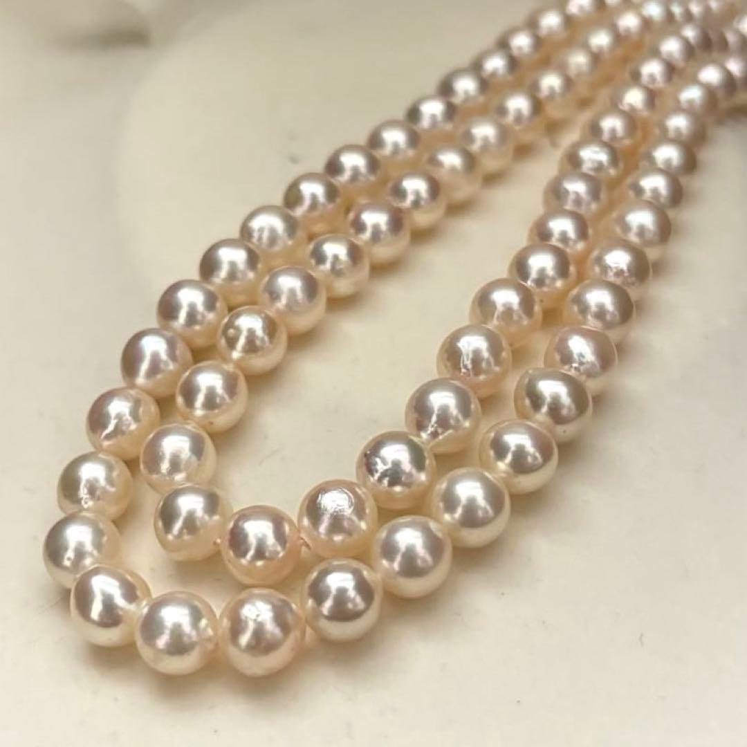 Long double-strand pearl necklace with large Akoya pearls and aurora interference colors in champagne or white gold