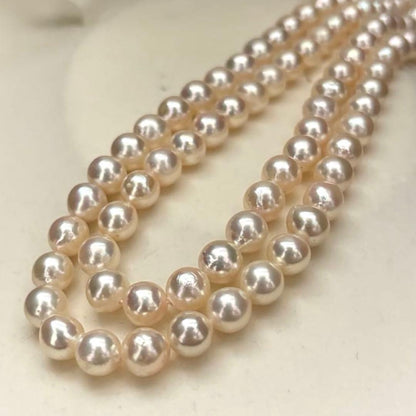 Long double-strand pearl necklace with large Akoya pearls and aurora interference colors in champagne or white gold