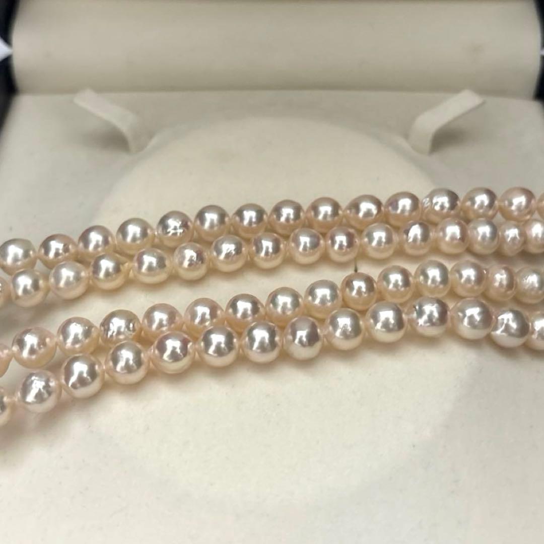 Long double-strand pearl necklace with large Akoya pearls and aurora interference colors in champagne or white gold