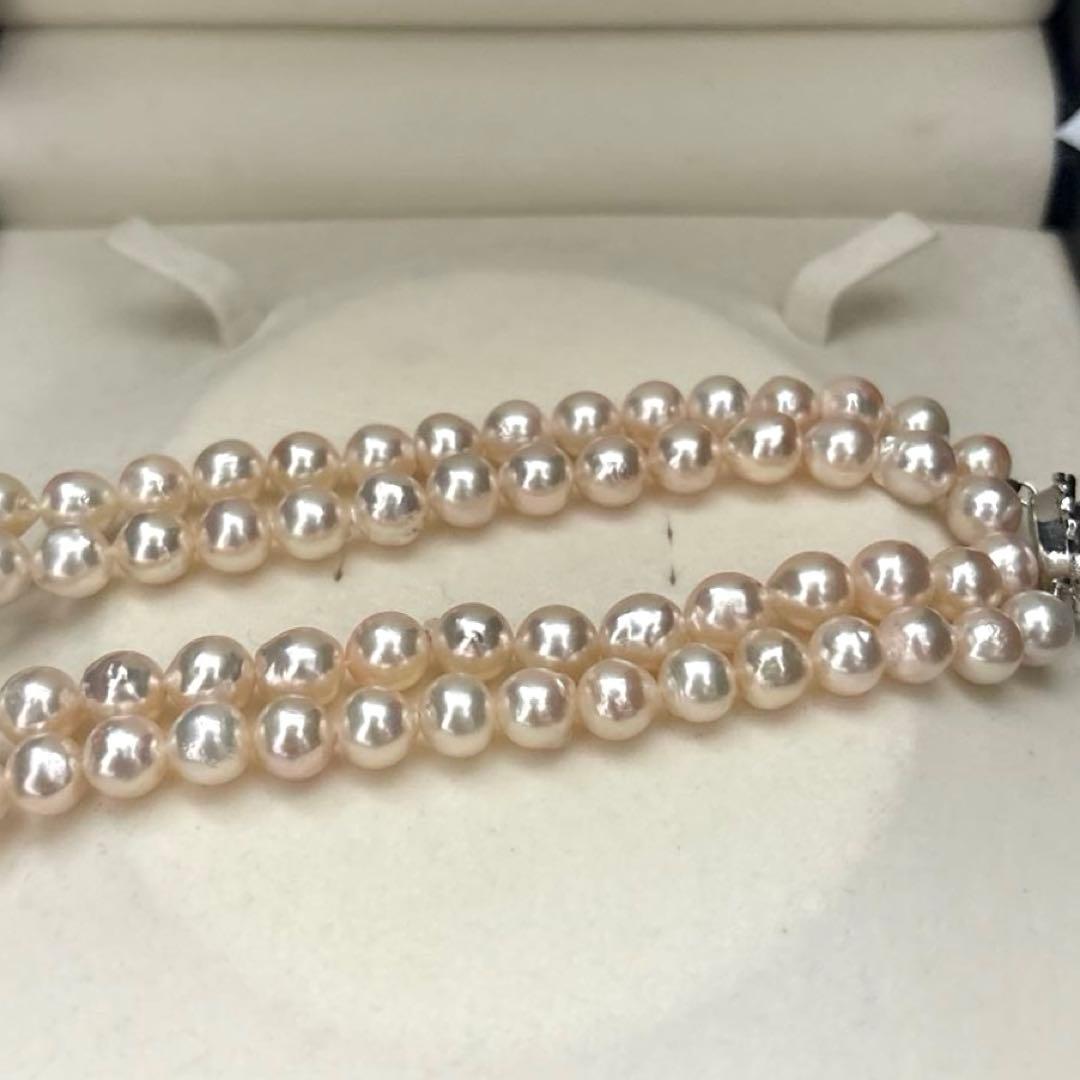 Long double-strand pearl necklace with large Akoya pearls and aurora interference colors in champagne or white gold