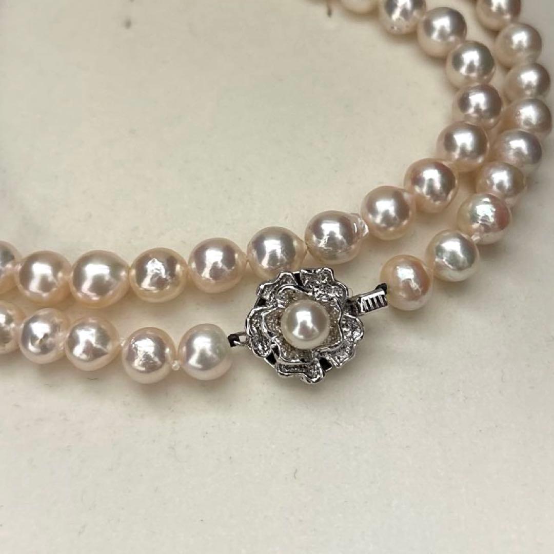 Long double-strand pearl necklace with large Akoya pearls and aurora interference colors in champagne or white gold