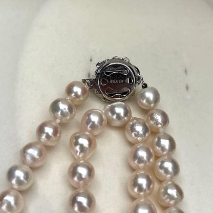 Long double-strand pearl necklace with large Akoya pearls and aurora interference colors in champagne or white gold