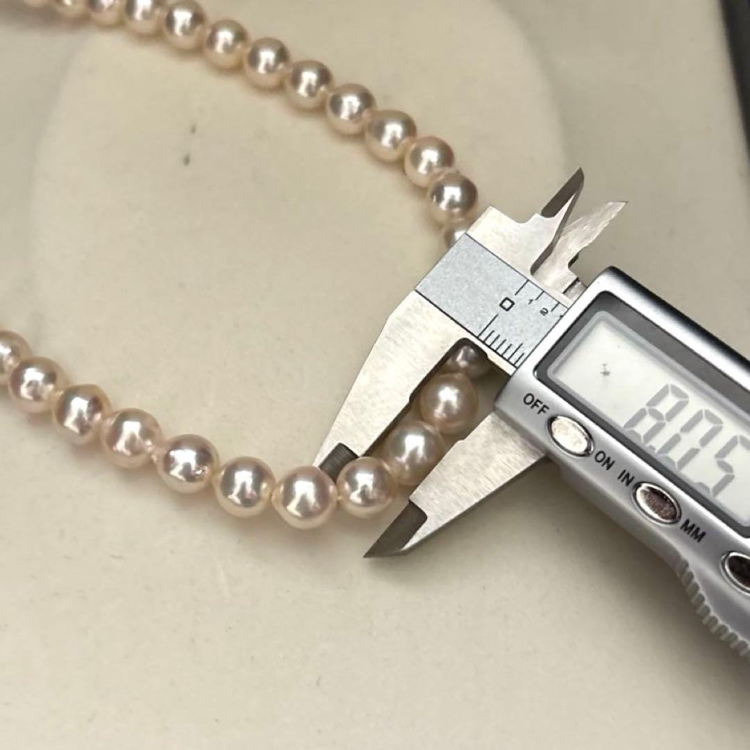 Long double-strand pearl necklace with large Akoya pearls and aurora interference colors in champagne or white gold