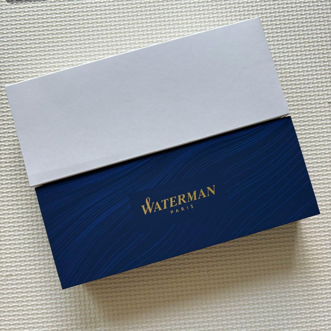 Waterman ballpoint pen in matte black with silver accents displayed with its box