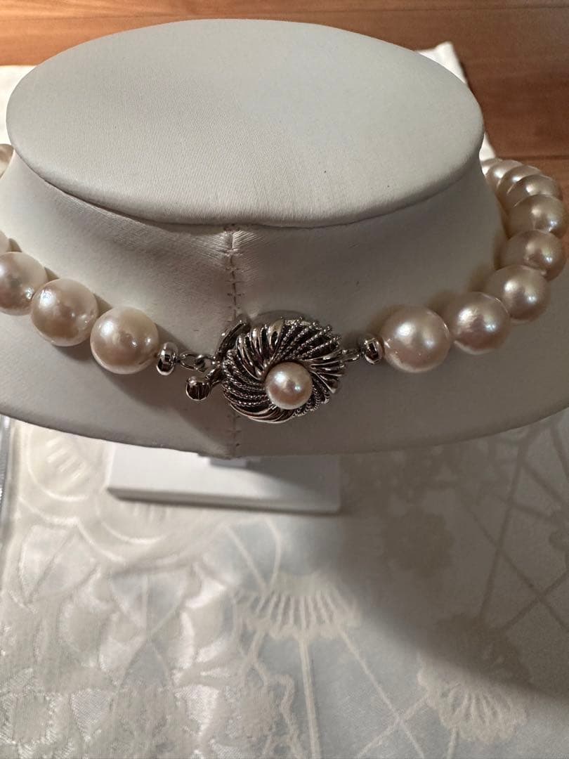 Akoya pearl necklace with 8.0-8.5mm white pearls and silver stamped clasp with certification tag