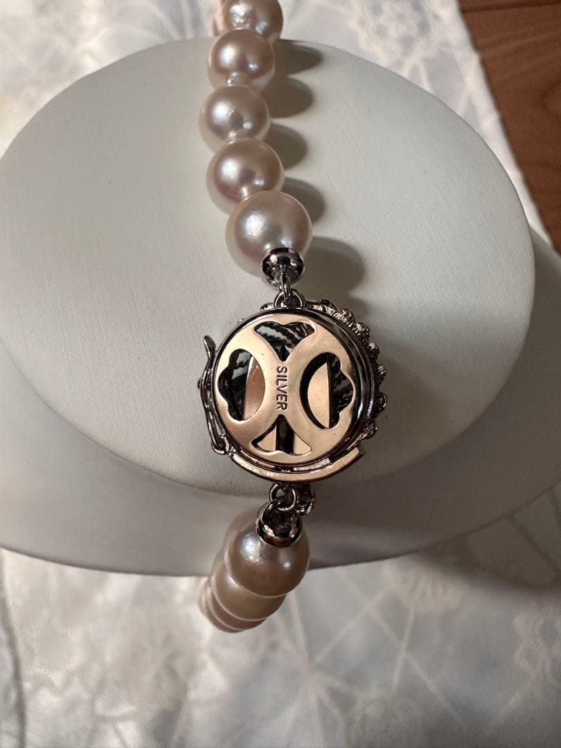 Akoya pearl necklace with 8.0-8.5mm white pearls and silver stamped clasp with certification tag