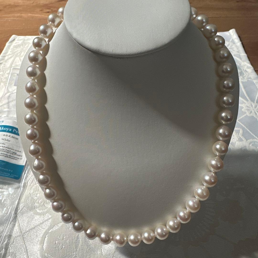 Akoya pearl necklace with 8.0-8.5mm white pearls and silver stamped clasp with certification tag