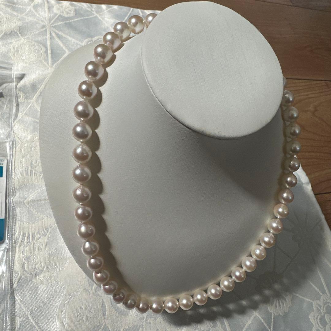 Akoya pearl necklace with 8.0-8.5mm white pearls and silver stamped clasp with certification tag