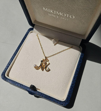 Mikimoto Baby Pearl Necklace with Initial M pendant in 18K yellow gold, 42cm chain, displayed with box