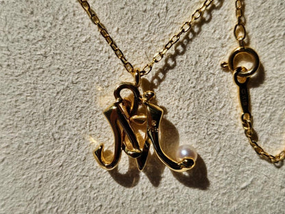 Mikimoto Baby Pearl Necklace with Initial M pendant in 18K yellow gold, 42cm chain, displayed with box