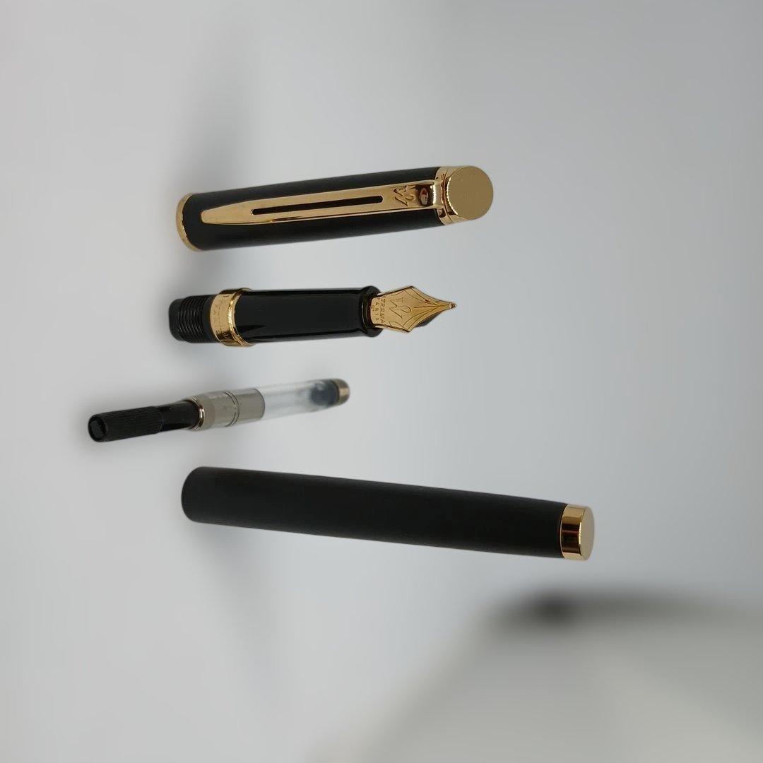 Waterman Matte Black Fountain Pen with fine nib and metal body displayed with case and instruction manual