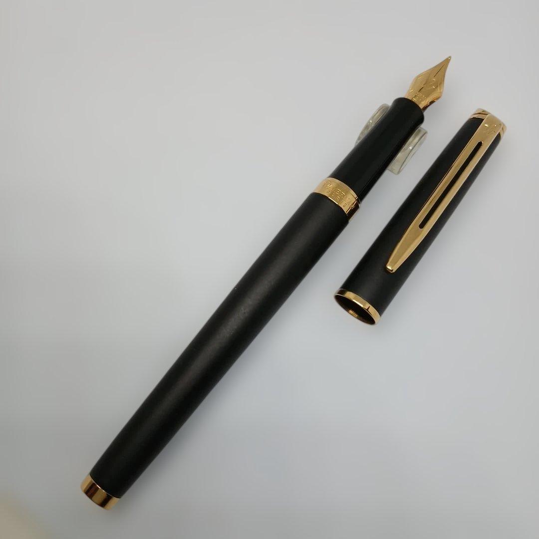 Waterman Matte Black Fountain Pen with fine nib and metal body displayed with case and instruction manual