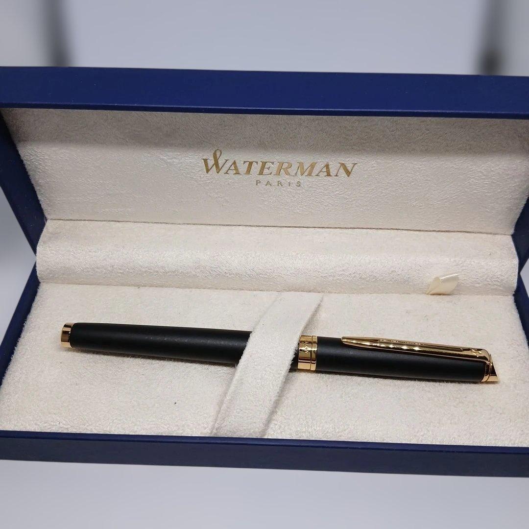 Waterman Matte Black Fountain Pen with fine nib and metal body displayed with case and instruction manual