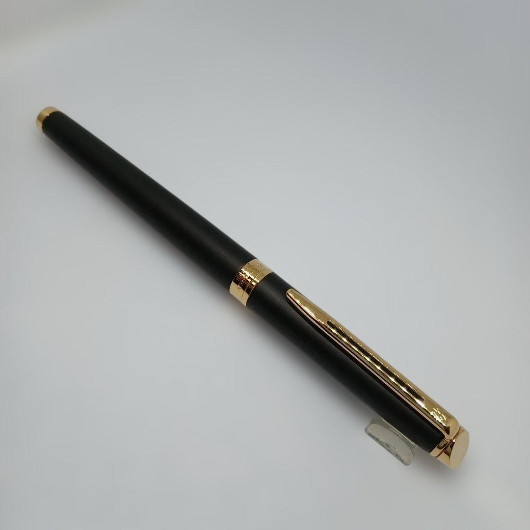 Waterman Matte Black Fountain Pen with fine nib and metal body displayed with case and instruction manual