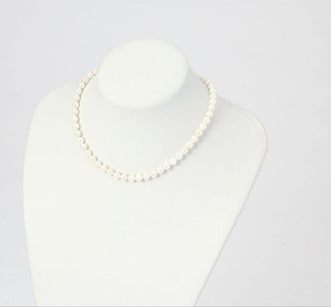 6.5mm Akoya pearl necklace approximately 42cm with matching earrings 13x6.5mm featuring natural pearl markings