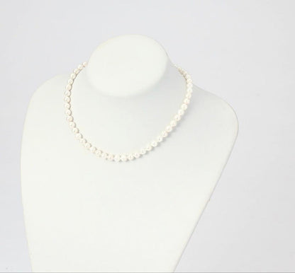 6.5mm Akoya pearl necklace approximately 42cm with matching earrings 13x6.5mm featuring natural pearl markings