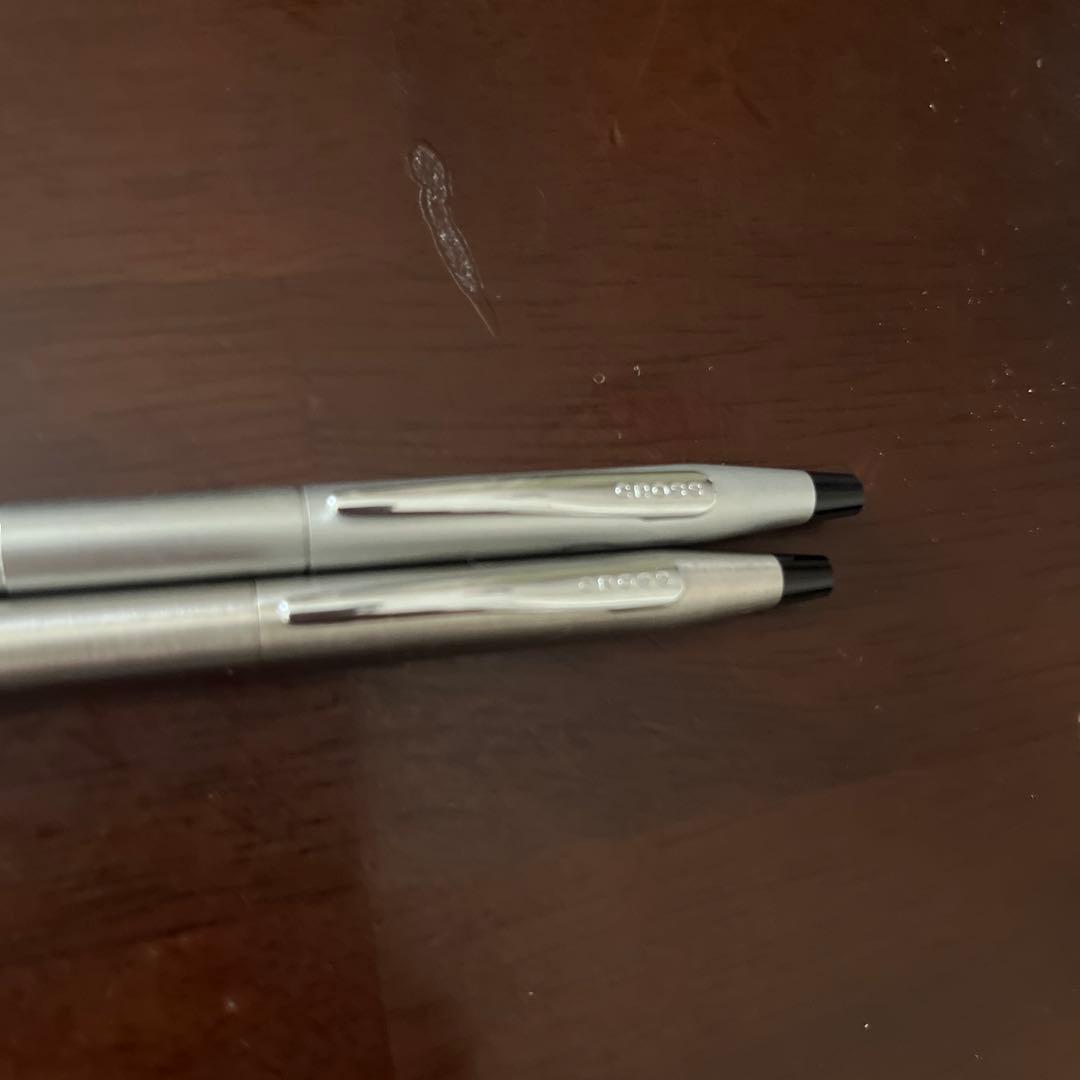 Used CROSS ballpoint fountain pen with sleek silver finish shown from side angle
