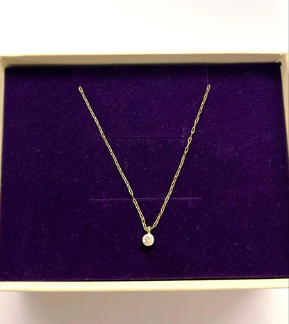 Agete necklace in yellow gold K18 with 0.1 carat diamond and mystery setting displayed on white background