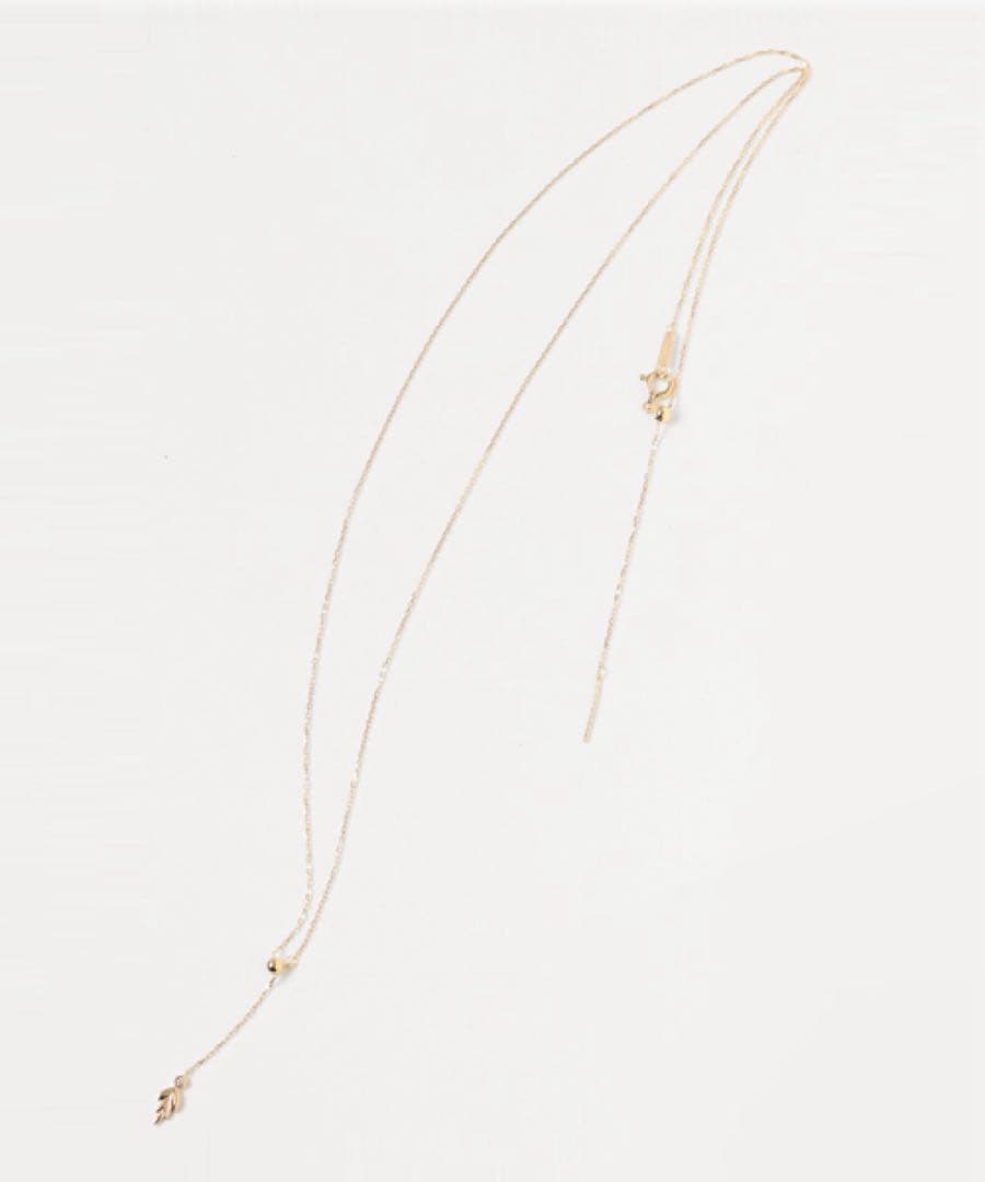 agete K10 gold Y-shaped necklace with a single diamond leaf pendant and sliding ball chain