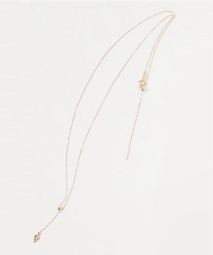 agete K10 gold Y-shaped necklace with a single diamond leaf pendant and sliding ball chain