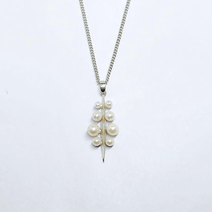 Mikimoto baby pearl necklace pendant top with silver chain and pearls sized 2.4 to 4.5 mm