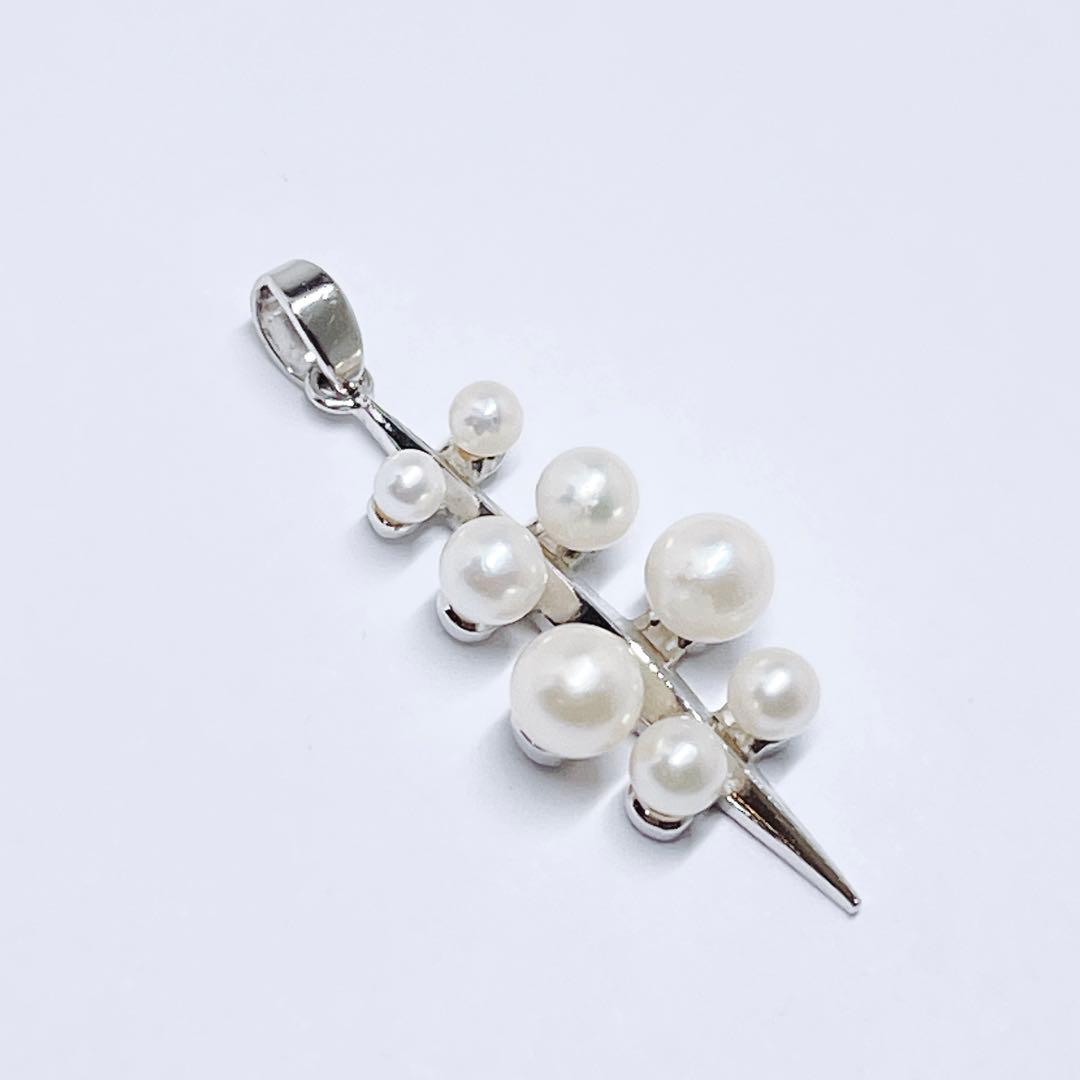 Mikimoto baby pearl necklace pendant top with silver chain and pearls sized 2.4 to 4.5 mm