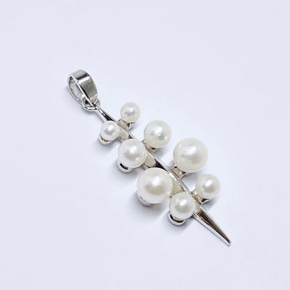 Mikimoto baby pearl necklace pendant top with silver chain and pearls sized 2.4 to 4.5 mm