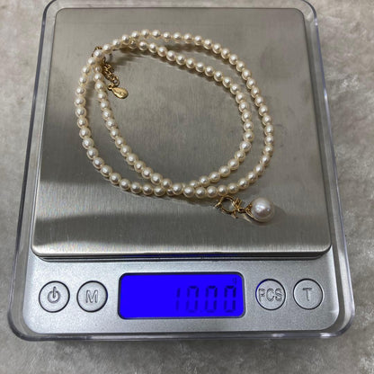 TASAKI pearl necklace with diamond charm in 18K gold, 39.5 cm length, displayed on white background