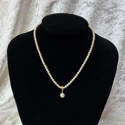 TASAKI pearl necklace with diamond charm in 18K gold, 39.5 cm length, displayed on white background