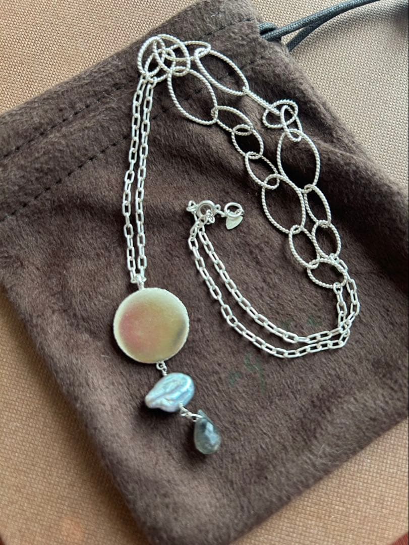 Agete silver necklace with 5 charms including pink stone, gray pearl, and labradorite on a 50cm chain