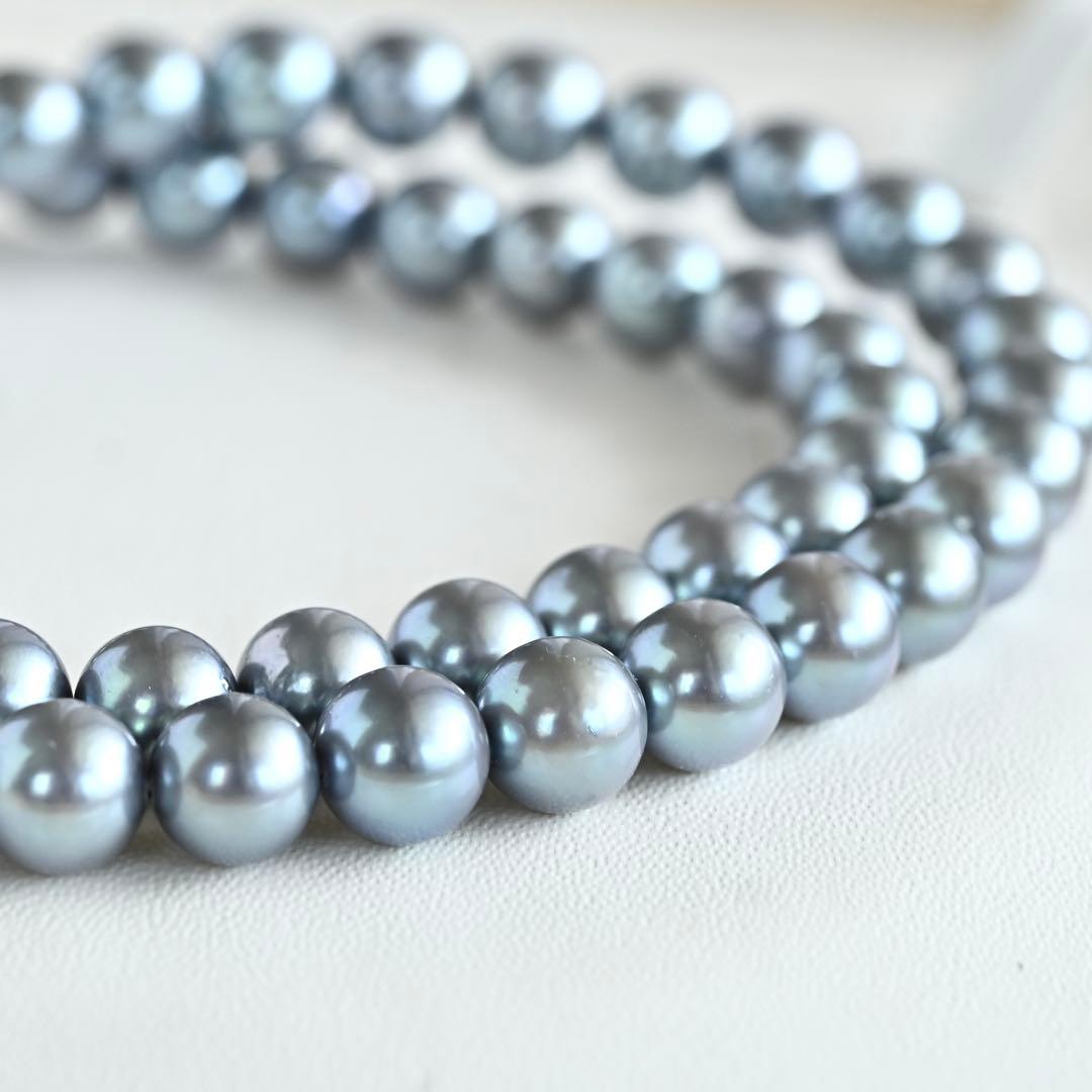 Swanklassup Tasaki Akoya natural blue pearl necklace with 7.5mm pearls displayed on white background