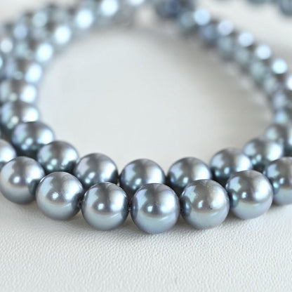 Swanklassup Tasaki Akoya natural blue pearl necklace with 7.5mm pearls displayed on white background