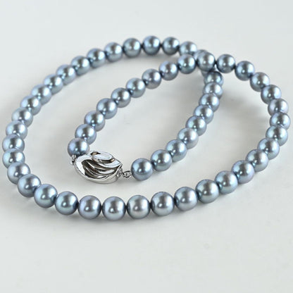 Swanklassup Tasaki Akoya natural blue pearl necklace with 7.5mm pearls displayed on white background
