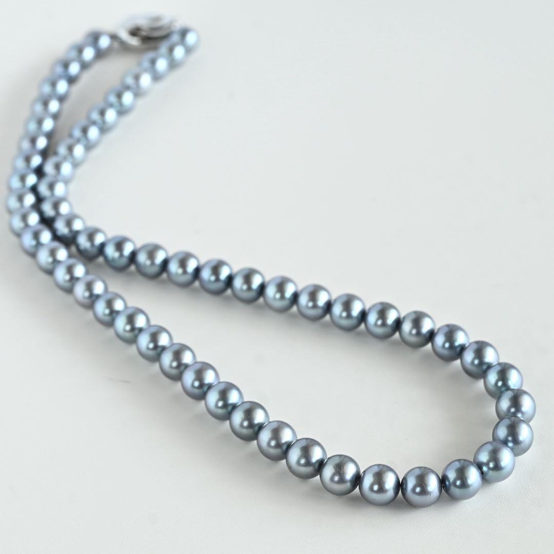 Swanklassup Tasaki Akoya natural blue pearl necklace with 7.5mm pearls displayed on white background