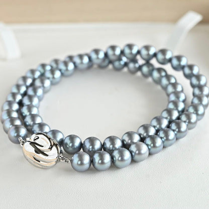 Swanklassup Tasaki Akoya natural blue pearl necklace with 7.5mm pearls displayed on white background
