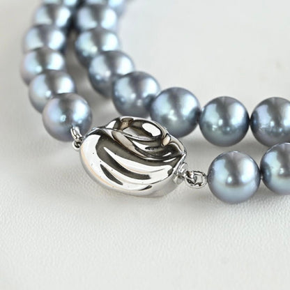 Swanklassup Tasaki Akoya natural blue pearl necklace with 7.5mm pearls displayed on white background