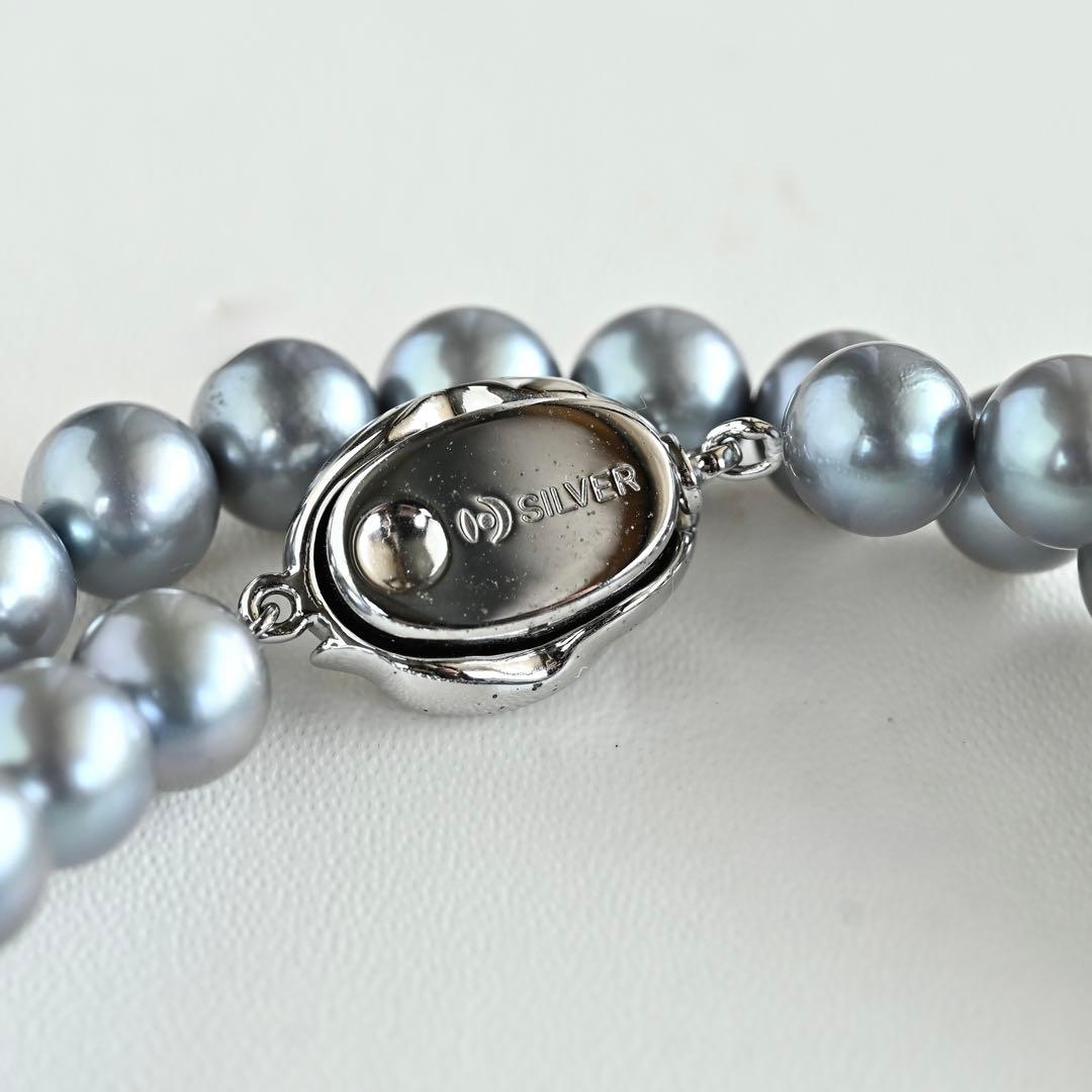 Swanklassup Tasaki Akoya natural blue pearl necklace with 7.5mm pearls displayed on white background