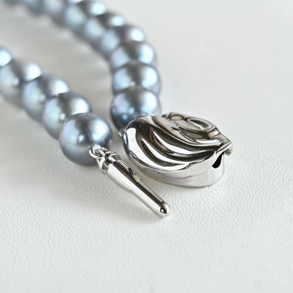 Swanklassup Tasaki Akoya natural blue pearl necklace with 7.5mm pearls displayed on white background