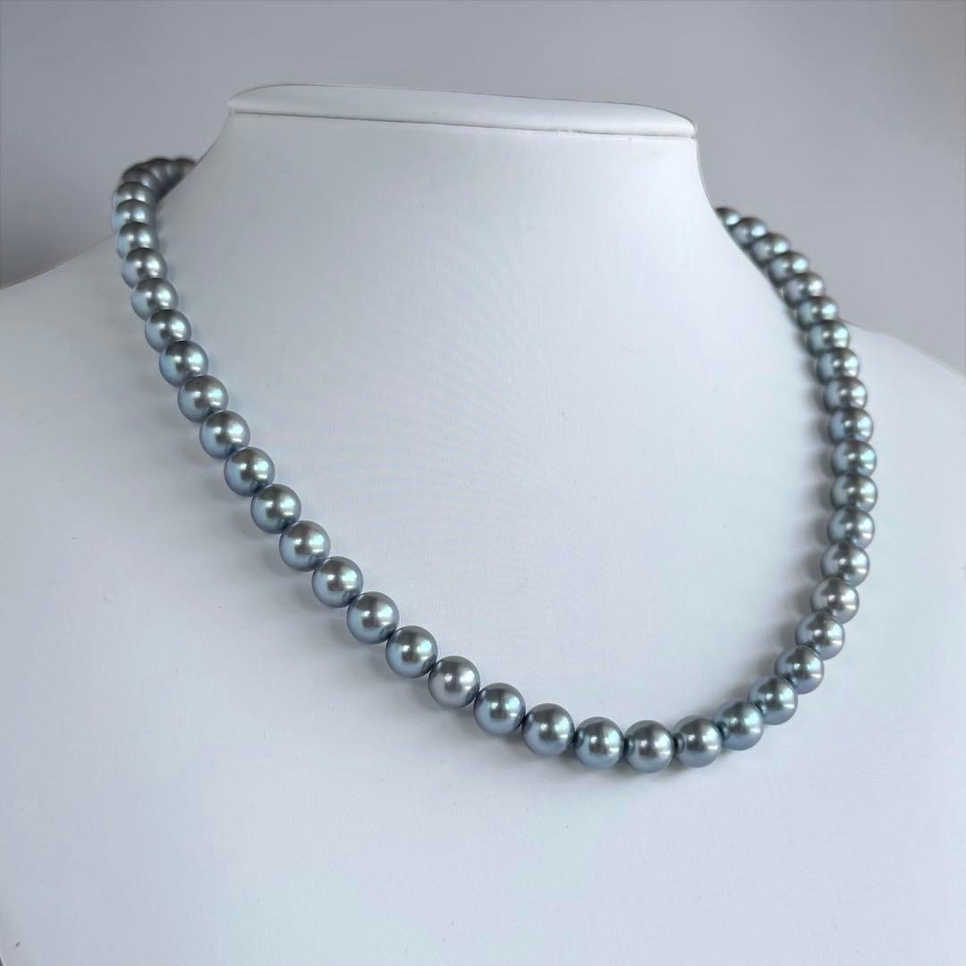 Swanklassup Tasaki Akoya natural blue pearl necklace with 7.5mm pearls displayed on white background